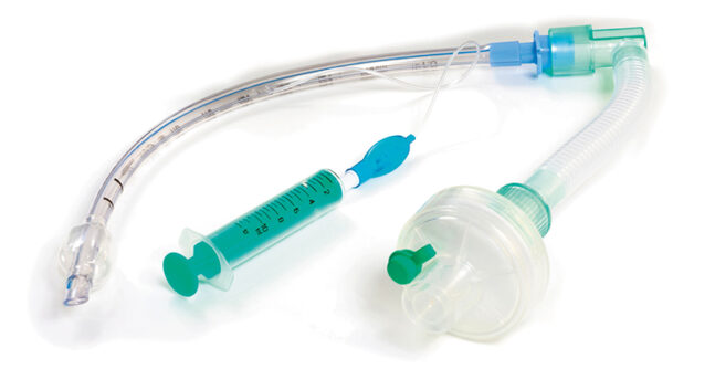 Tracheostomy tubing, filter, connector, and syringe.