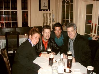 Four adult siblings gather around a table